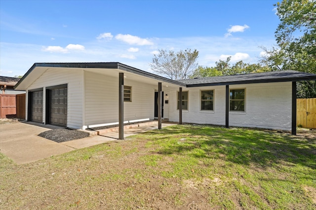 back of house featuring a yard