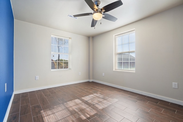 unfurnished room with ceiling fan and dark hardwood / wood-style floors