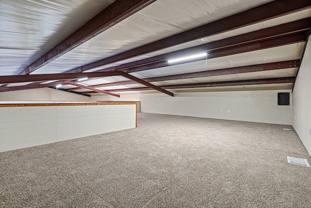 bonus room with lofted ceiling with beams and carpet floors