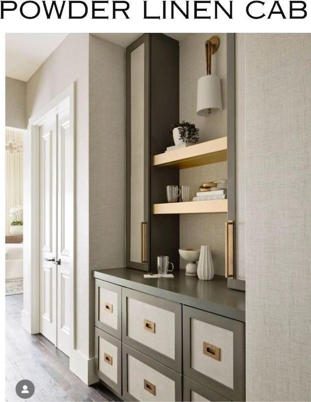 bar with hardwood / wood-style flooring and gray cabinetry