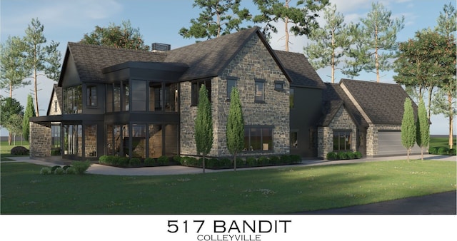 view of front of home with a garage and a front lawn