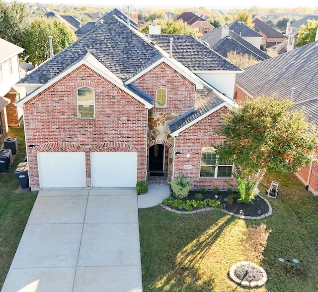 front of property with cooling unit, a front yard, and a garage