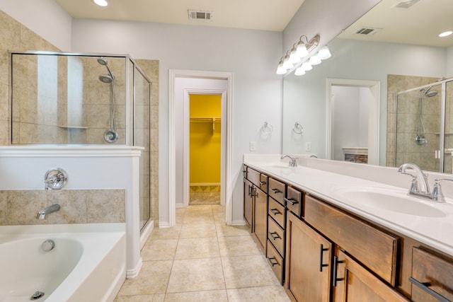 bathroom featuring tile patterned floors, vanity, and independent shower and bath