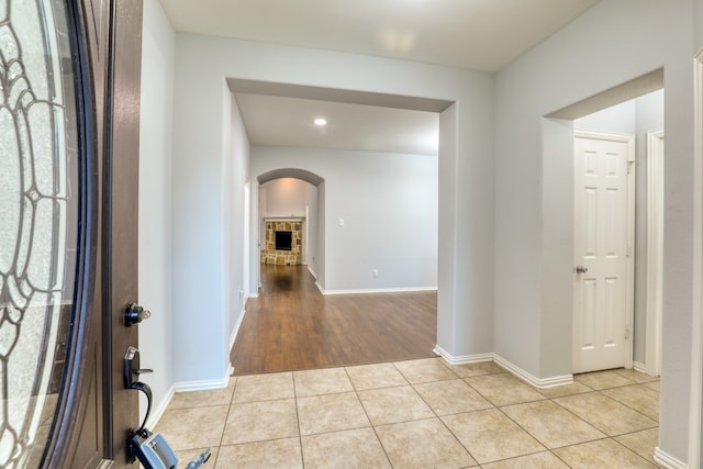 hallway with light hardwood / wood-style floors