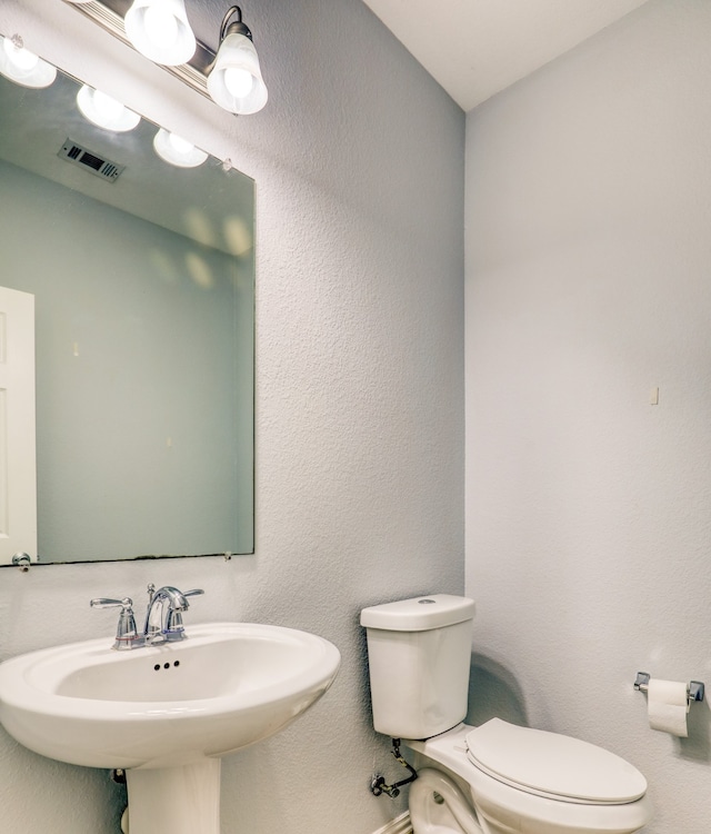 bathroom with toilet and sink