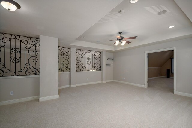 bedroom with light carpet, vaulted ceiling, and ceiling fan