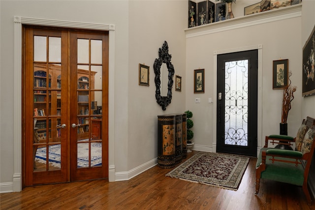 entrance foyer with hardwood / wood-style flooring, a healthy amount of sunlight, and french doors