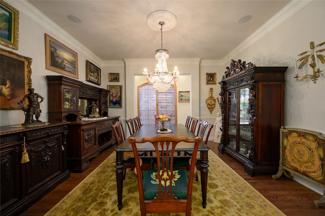 dining room with a chandelier, dark hardwood / wood-style floors, and ornamental molding