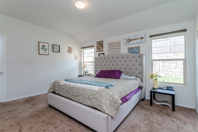 carpeted bedroom featuring vaulted ceiling