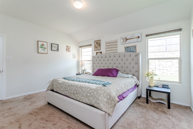 bedroom featuring carpet flooring and vaulted ceiling