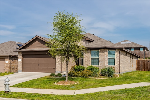 view of front facade with a garage and a front lawn