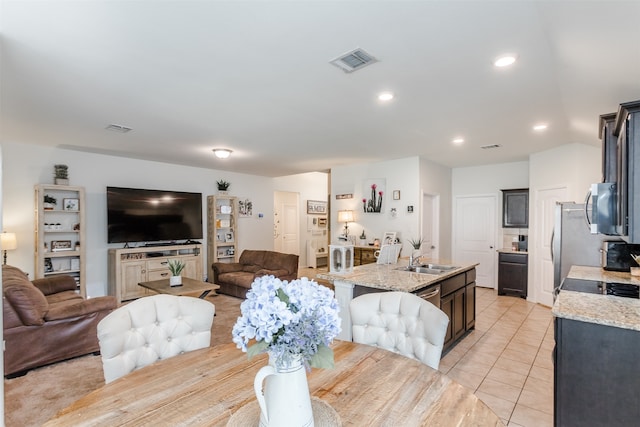 interior space featuring sink and light tile patterned flooring