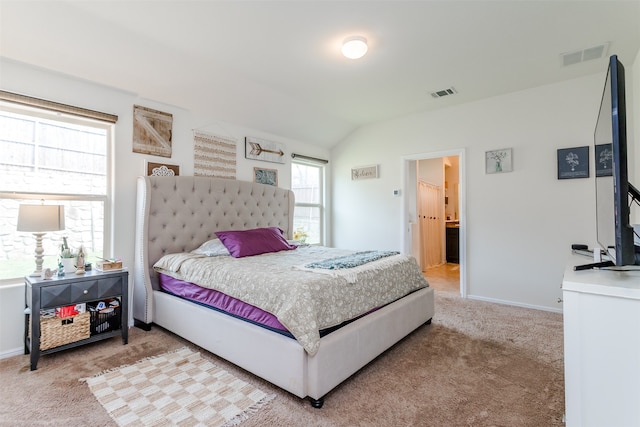 bedroom featuring carpet floors and vaulted ceiling