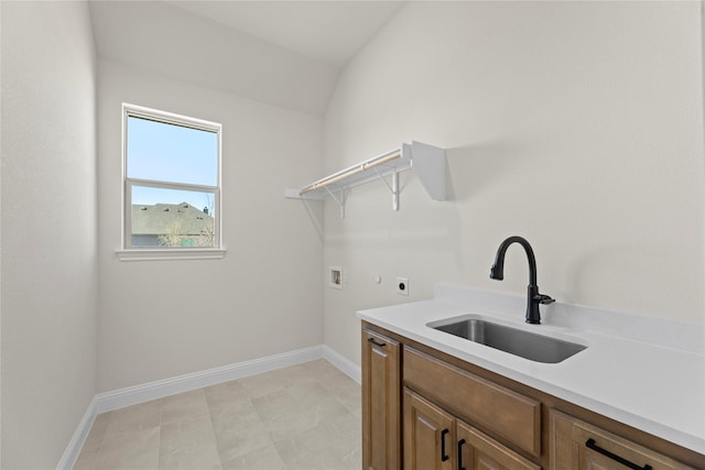 washroom featuring sink, washer hookup, hookup for an electric dryer, and cabinets