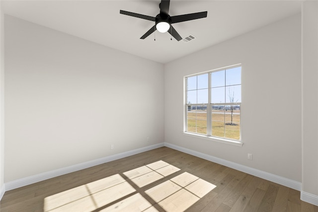 unfurnished room with ceiling fan and wood-type flooring