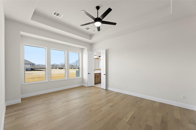 unfurnished bedroom with ceiling fan and light colored carpet