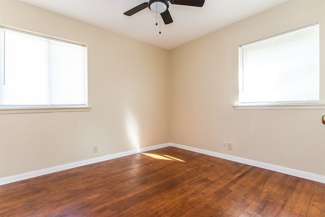 unfurnished room featuring hardwood / wood-style flooring, ceiling fan, and a healthy amount of sunlight