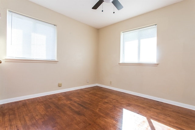 empty room featuring ceiling fan and hardwood / wood-style flooring