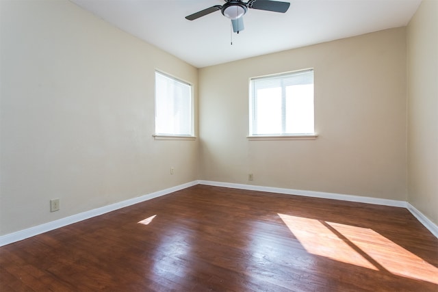 empty room featuring dark hardwood / wood-style floors and ceiling fan