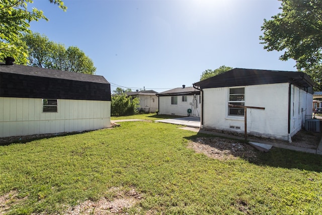 view of yard with a patio area and central AC