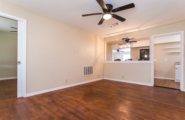 unfurnished living room featuring dark wood-type flooring