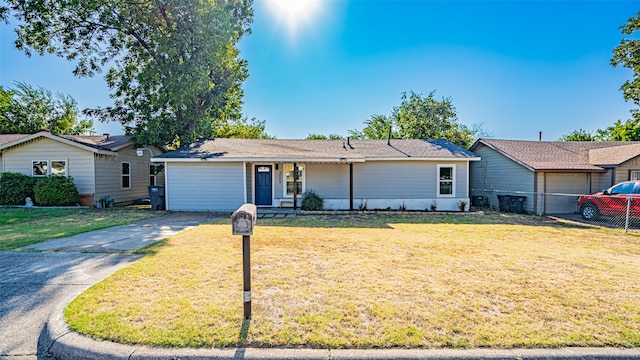 ranch-style home with a front yard