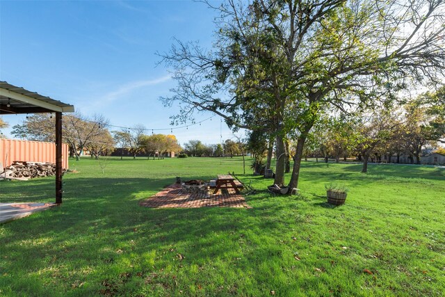 view of yard featuring a fire pit