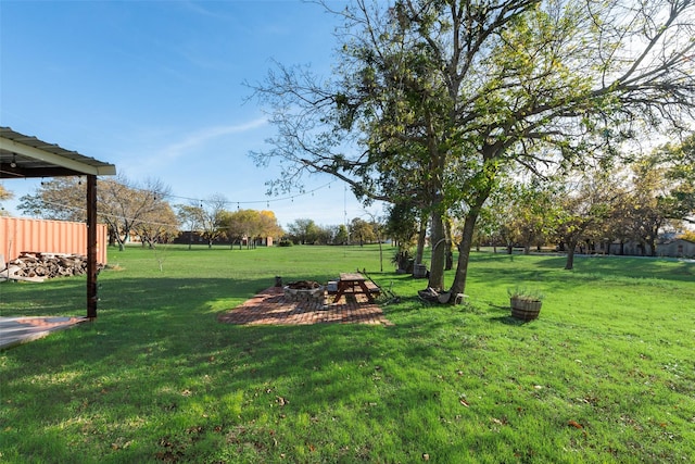 view of yard featuring a fire pit