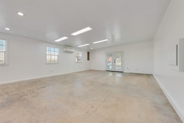 unfurnished room with a wall mounted air conditioner