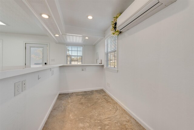 walk in closet featuring a wall mounted AC