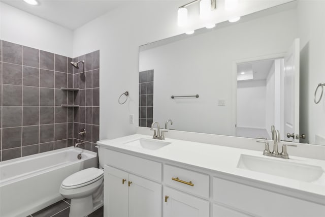 full bathroom featuring vanity, toilet, and tiled shower / bath