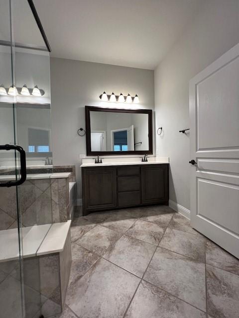 bathroom featuring vanity and shower with separate bathtub