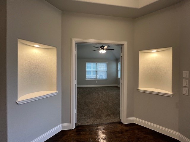 hallway with dark hardwood / wood-style floors