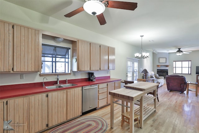 kitchen featuring light brown cabinetry, sink, a chandelier, dishwasher, and light hardwood / wood-style floors