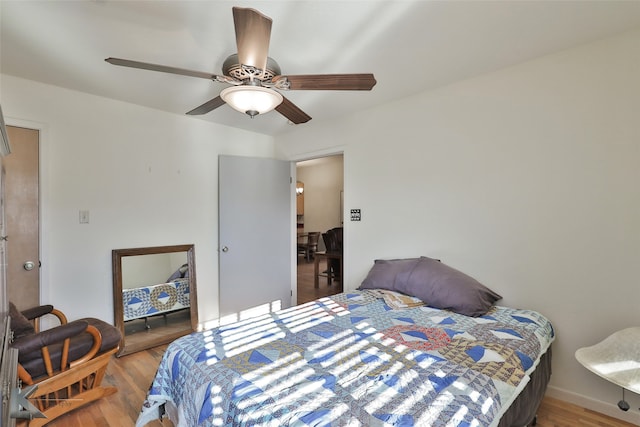 bedroom featuring ceiling fan and wood-type flooring