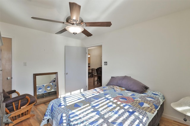 bedroom featuring ceiling fan and light wood-type flooring