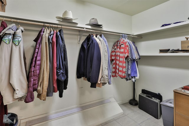 spacious closet featuring light tile patterned flooring