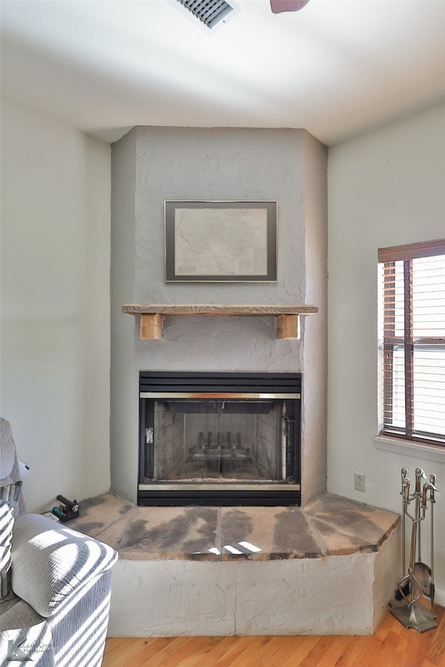 room details featuring a fireplace and hardwood / wood-style floors