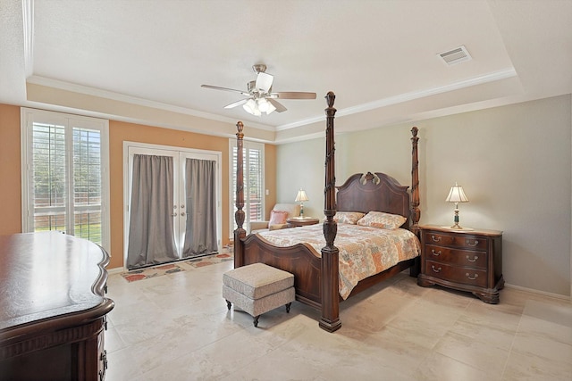 bedroom with a raised ceiling, ceiling fan, crown molding, and french doors