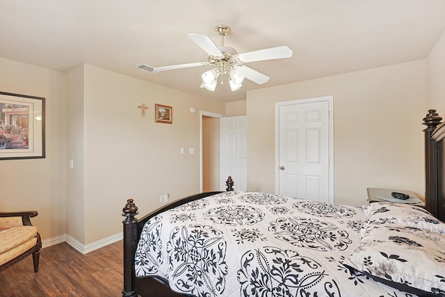 bedroom with ceiling fan and dark wood-type flooring