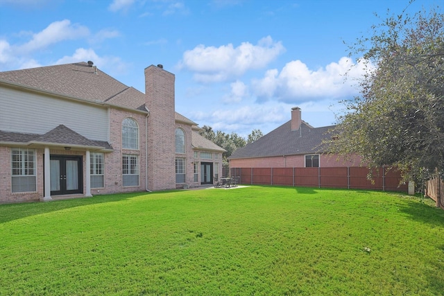 view of yard with french doors