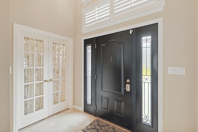 tiled foyer with french doors