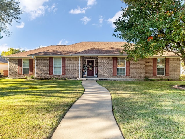 ranch-style house featuring a front lawn