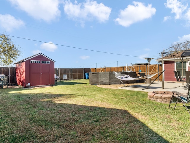 view of yard featuring a patio area and a shed