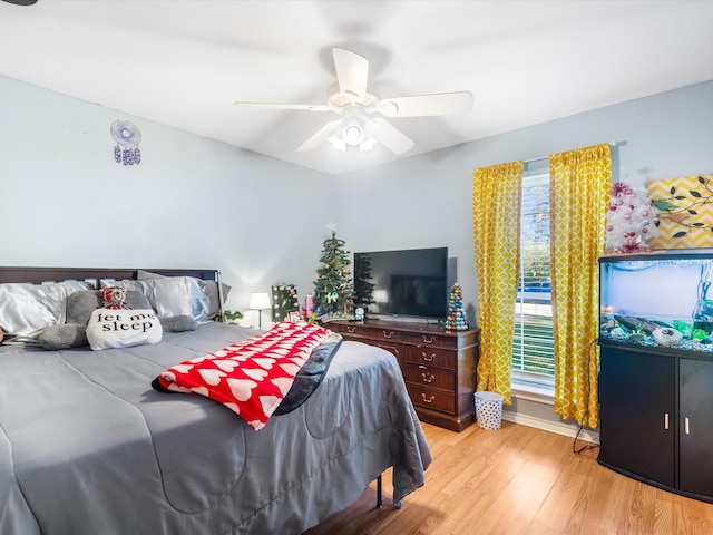 bedroom featuring light hardwood / wood-style flooring and ceiling fan