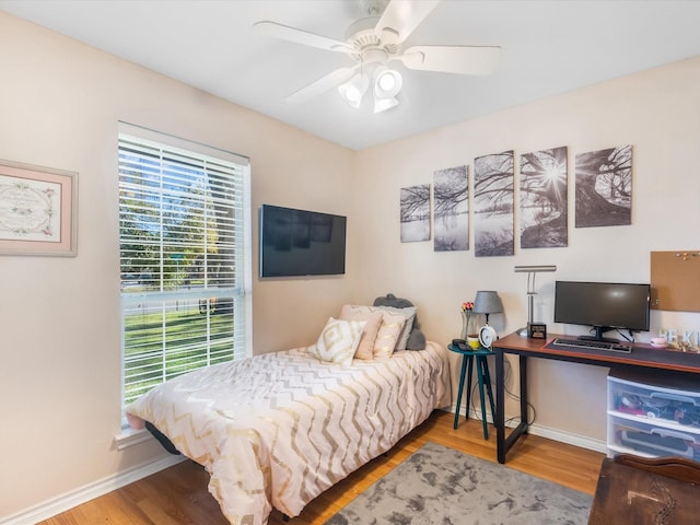 bedroom featuring ceiling fan and hardwood / wood-style flooring