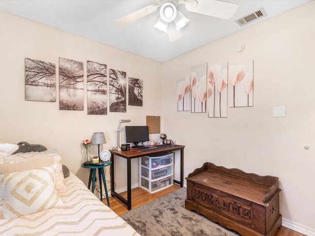 bedroom featuring hardwood / wood-style flooring and ceiling fan