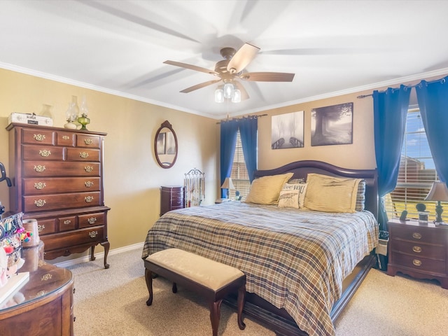 carpeted bedroom with ceiling fan and crown molding