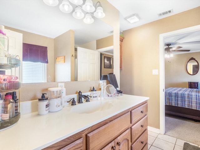 bathroom featuring tile patterned flooring, vanity, and ceiling fan