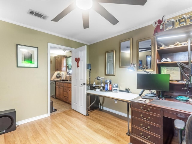 office space featuring ceiling fan, ornamental molding, sink, and light hardwood / wood-style flooring